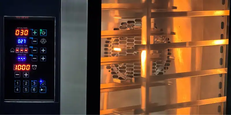 Digital control panel of GLEAN commercial convection oven showing temperature, time, and spray displays with preset buttons and visible heating element