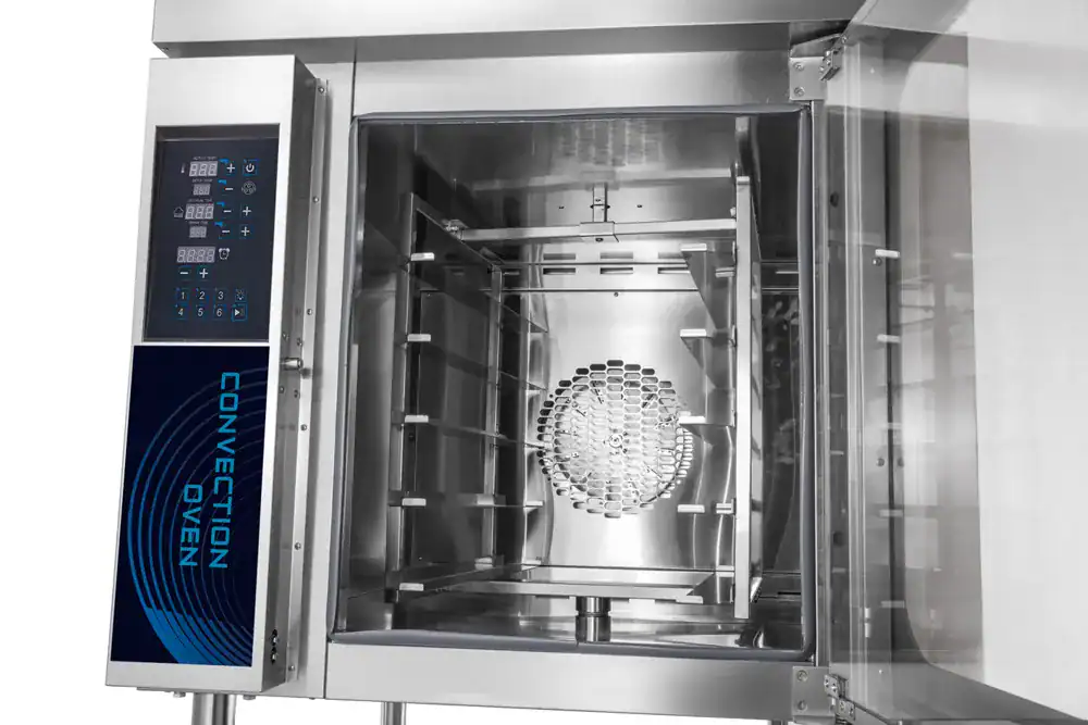 Open rotating convection oven showing the central rotating rack and rear fan